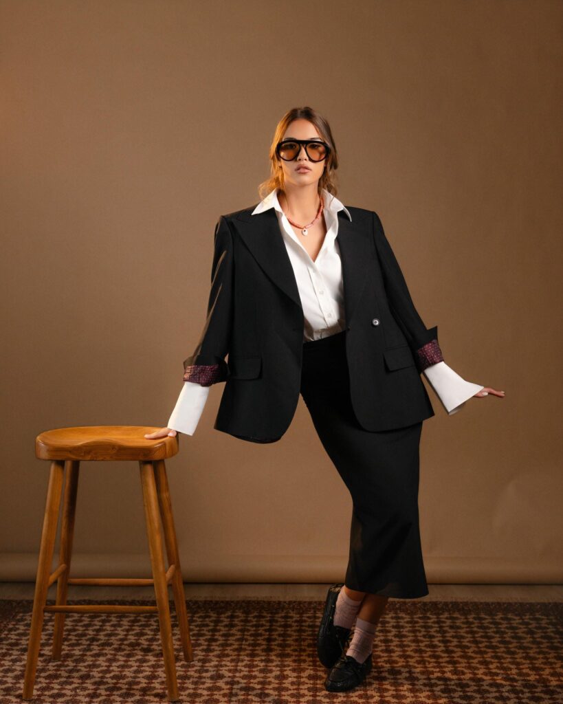 Black Wool 3-Button Blazer with patterned cuffs, worn over a white shirt and black midi skirt