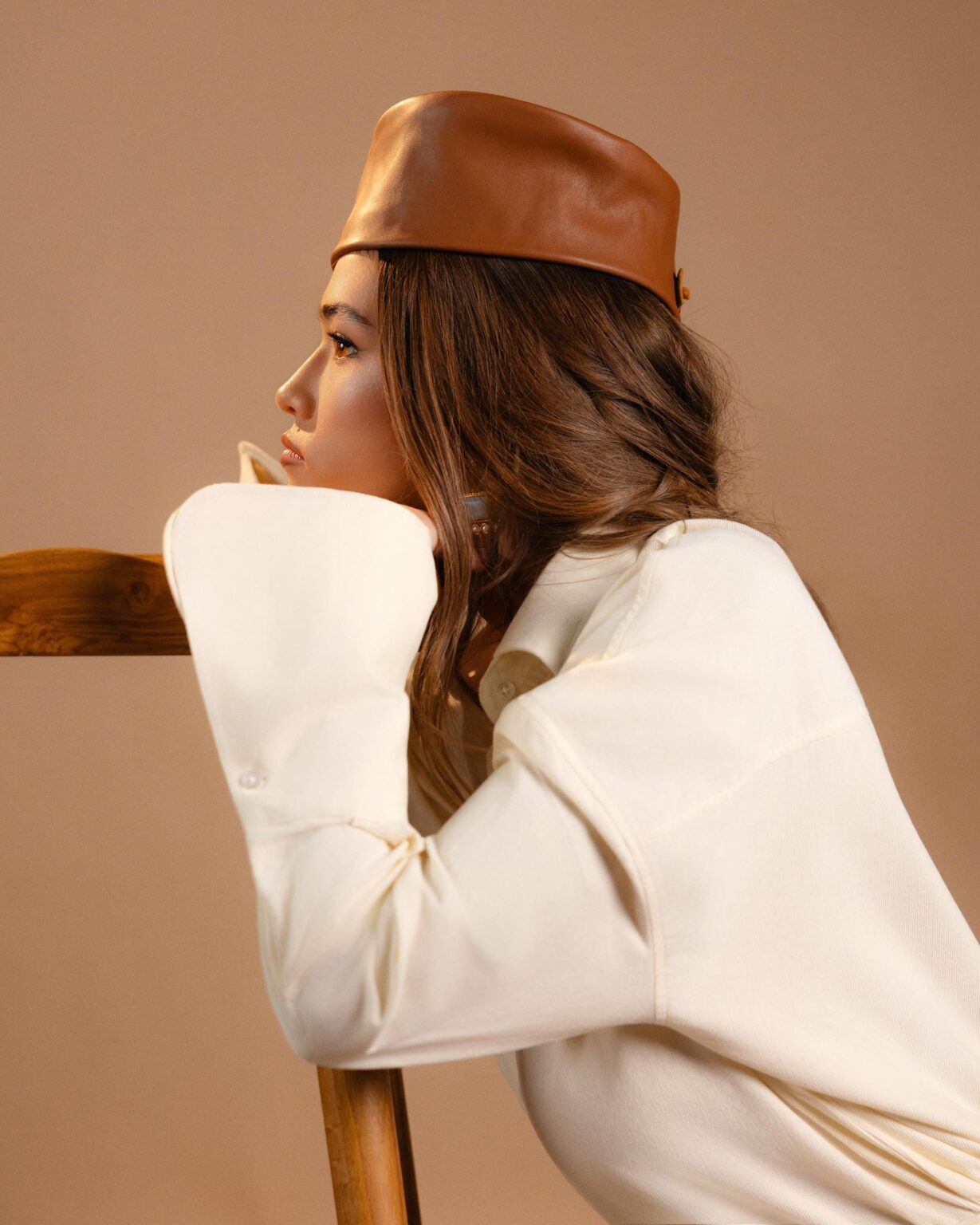 Vanilla Corduroy Bell Sleeve Shirt worn with a tan leather hat, side profile